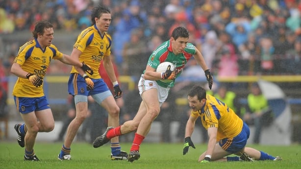 17 July 2011; Alan Freeman, Mayo, in action against Roscommon players left to right, Conor Devaney, Senan O'Grady and Niall Carty. Connacht GAA Football Senior Championship Final, Roscommon v Mayo, Dr. Hyde Park, Roscommon. Picture credit: David Maher / SPORTSFILE