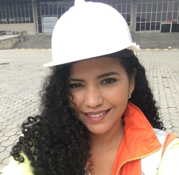 Headshot of Lorena Prasca Ramirez wearing a white builder's helmet