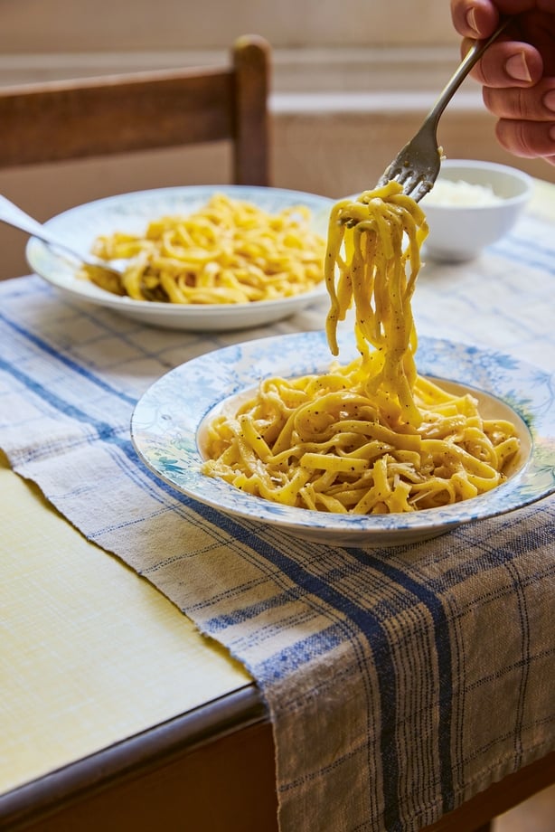 Bowls of pasta on a kitchen table