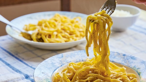 Bowls of pasta on a kitchen table