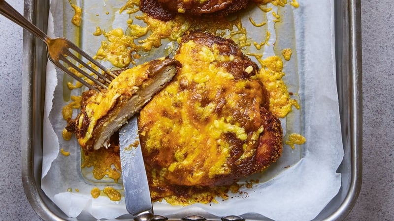 Chicken parmo with cheese and curry sauce