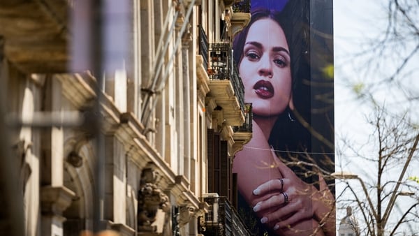A giant poster depicting Rosalía is displayed three days before her concert in Barcelona on 10 April, 2026. (Photo by Josep Lago/AFP)