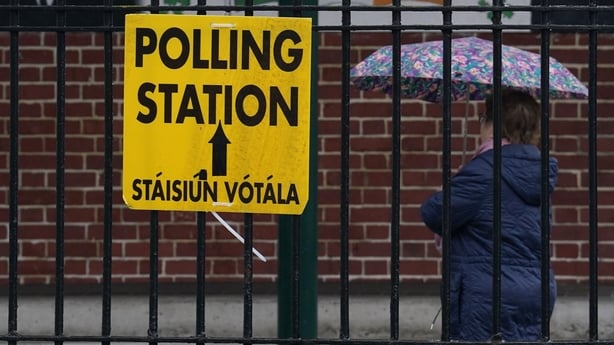 People arrive to cast their votes at St Laurence O'Tooles National School in Dublin