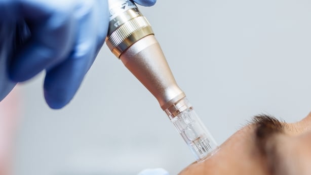 Close up of cosmetologist holding tool with needle
