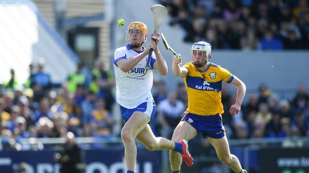 19 April 2026; Sean Walsh of Waterford shoots to score his side's fourth goal, despite the efforts of Diarmuid Ryan of Clare during the Munster GAA Senior Hurling Championship Round 1 match between Clare and Waterford at Zimmer Biomet Páirc Chíosóg in Ennis, Clare. Photo by John Sheridan/Sportsfile