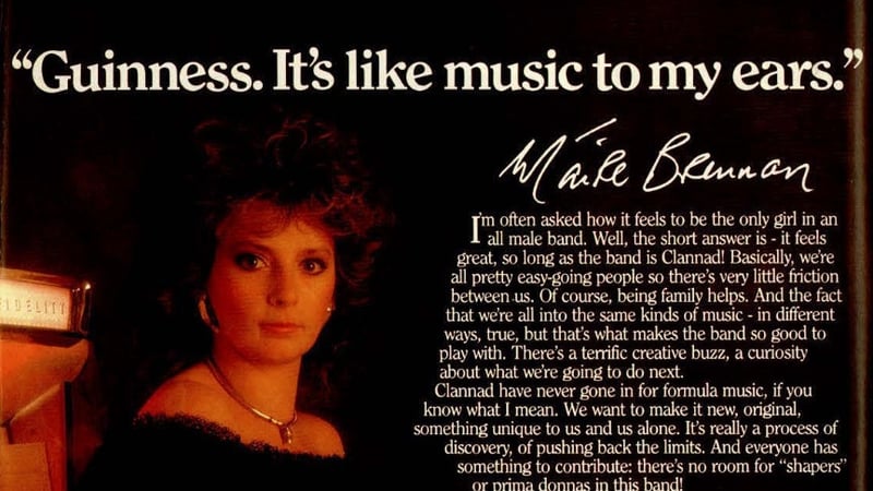 Moya Brennan poses in black dress holding a pint for a Guinness ad in the RTÉ Guide cropped