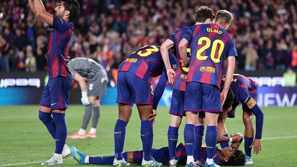 Barcelona's Spanish forward #07 Ferran Torres (L) asks for substitution as Barcelona's Spanish forward #10 Lamine Yamal lies on the ground after sustaining an injury during the Spanish league football match between FC Barcelona and RC Celta de Vigo at Cam