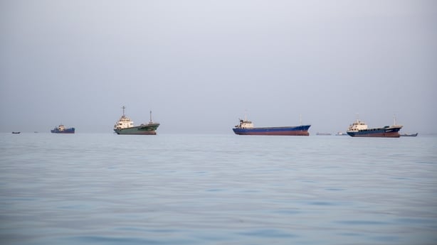 Ships anchored near the Iranian coast in the Strait of Hormuz