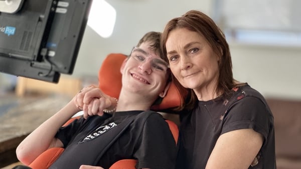 Luke Miggin, who suffered brain damage at birth, with his mother, Emily