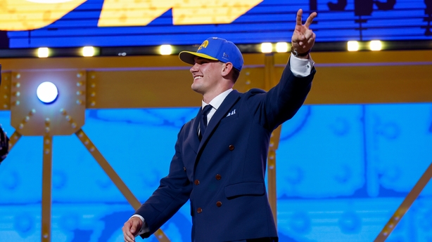 Ty Simpson of Alabama celebrates after being selected 13th overall by the Los Angeles Chargers during Round One of the 2026 NFL Draft at Acrisure Stadium on April 23, 2026 in Pittsburgh, Pennsylvania.
