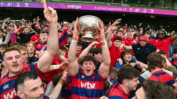 Oran Walsh of Clontarf lifts the cup as his team-metes celebrate after the Energia All-Ireland League Men's Division 1A final match between Clontarf and Cork Constitution at the Aviva Stadium in Dublin. Photo by Matt Browne/Sportsfile