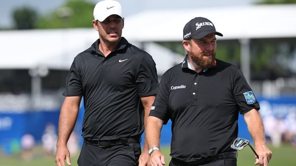 Brooks Koepka and Shane Lowry react after their birdie on the 18th hole during the second at TPC Louisiana