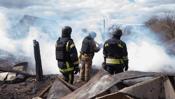 SHOSTKA, UKRAINE - APRIL 24: Firefighters extinguish a fire in the backyard of a house following a Russian drone attack in the city of Shostka, northeastern Ukraine, on April 24, 2026. (Photo by Francisco Richart/Anadolu via Getty Images)