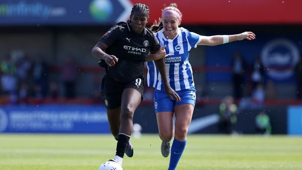 CRAWLEY, ENGLAND - APRIL 25: Khadija Shaw of Manchester City is challenged by Caitlyn Hayes of Brighton & Hove Albion during the Barclays Women's Super League match between Brighton & Hove Albion and Manchester City at Broadfield Stadium on April 25, 2026