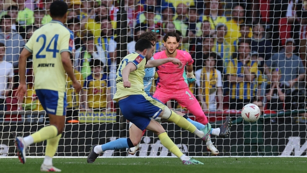 Southampton's Irish midfielder #10 Finn Azaz (C) shoots to score the opening goal of the English FA Cup semi final football match between Manchester City and Southampton at Wembley stadium in London, on April 25, 2026. 
