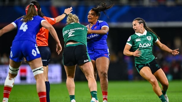 25 April 2026; Cliodhna Moloney MacDonald of Ireland and Ambre Mwayembe of France tussle during the Women's Six Nations Rugby Championship match between France and Ireland at Stade Marcel Michelin in Clermont, France. Photo by Shauna Clinton/Sportsfile