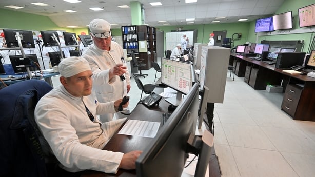 Employees of the control panel of the New Safe Confinement (NSC), covering the destroyed fourth reactor at the Chernobyl Nuclear Power Plant, work on April 23, 2026. Ukraine will on April 26, 2026 mark the 40th anniversary of the Chernobyl accident, the worst civilian nuclear disaster in history. Th
