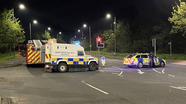 Police vehicles at the scene of a security alert in Belfast