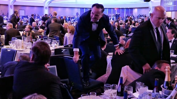 White House Deputy Chief of Staff Dan Scavino jumps over a chair after an incident at the annual White House Correspondents Association Dinner.