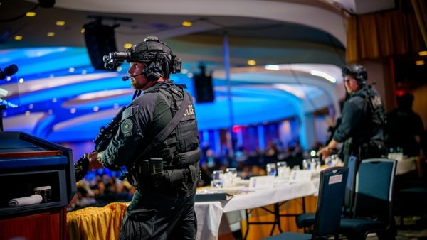 WASHINGTON, DC - APRIL 25: Armed Secret Service agents stand on stage during a shooting incident at the annual White House Correspondents Association Dinner at the Washington Hilton on April 25, 2026 in Washington, DC. According to reports, President Dona