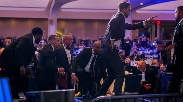 WASHINGTON, DC - APRIL 25: Health and Human Services Secretary Robert F. Kennedy Jr. (3rd-L) is taken out of the ballroom by security agents during a shooting incident at the annual White House Correspondents Association Dinner at the Washington Hilton on April 25, 2026 in Washington, DC. According 