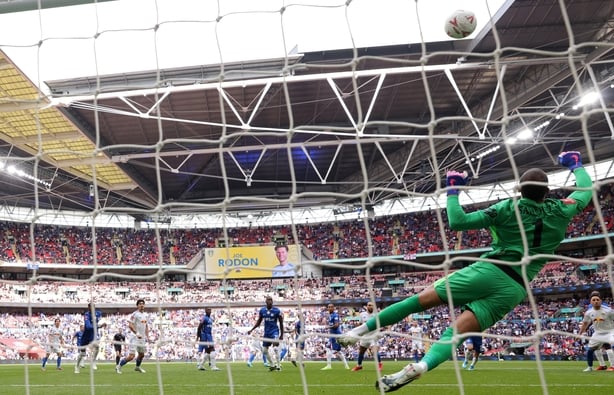 Chelsea's Spanish goalkeeper #01 Robert Sanchez saves a long-range shot from Leeds United's German midfielder #18 Anton Stach during the English FA Cup semi final football match between Chelsea and Leeds United at Wembley stadium in London, on April 26, 2026.