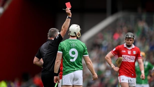 Referee James Owens issues a red card to Cian Lynch