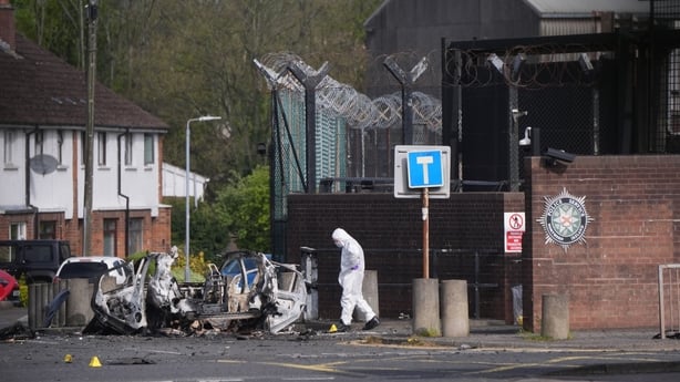 Forensic investigators at the scene in Dunmurry in Northern Ireland after reports of a car explosion outside a police station. Homes in the area, which is on the outskirts of Belfast, have been evacuated and members of the public have been advised to avoid the scene. Picture date: Sunday April 26, 2