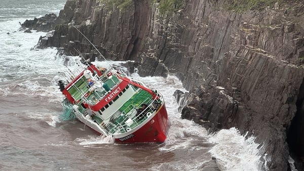The Fastnet grounded on rocks in the sea