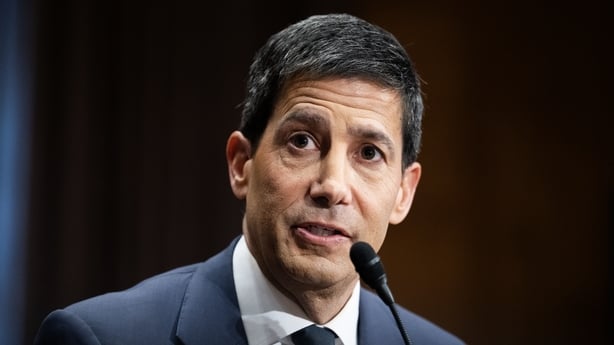 Image of a businessman speaking into a mike