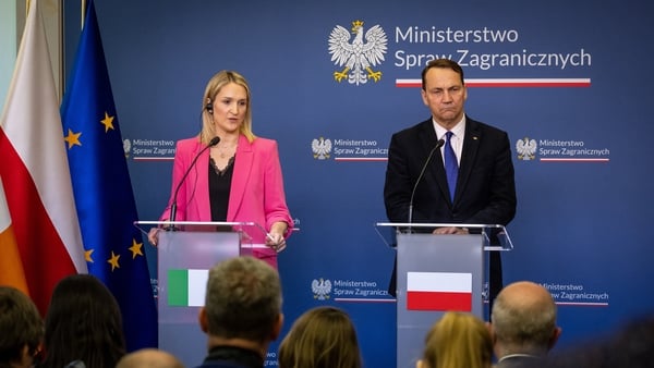 Ireland's Minister for Foreign Affairs and Trade and Minister of Defence Helen McEntee (L) and Poland's Deputy Prime Minister and Minister of Foreign Affairs Radoslaw Sikorski (R) attend a joint press conference after their meeting in Ministry building in