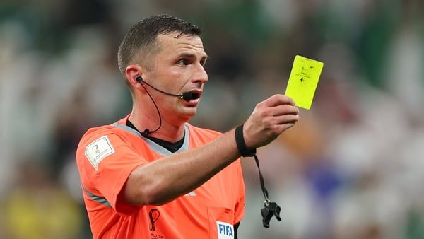 LUSAIL CITY, QATAR - NOVEMBER 30: Abdullah Madu of Saudi Arabia is shown a yellow card by referee Michael Oliver during the FIFA World Cup Qatar 2022 Group C match between Saudi Arabia and Mexico at Lusail Stadium on November 30, 2022 in Lusail City, Qata