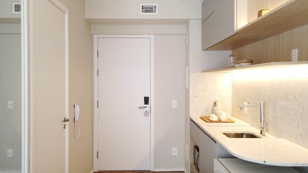 stock image of hotel room with kitchenette