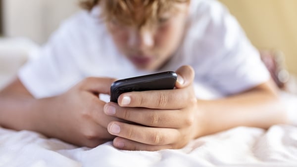 Teen boy on a mobile phone