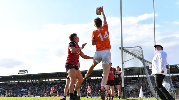 27 April 2024; Andrew Murnin of Armagh tries to keep the ball in possession despite the attention of Pierce Laverty of Down during the Ulster GAA Football Senior Championship semi-final match between Down and Armagh at St Tiernach's Park in Clones, Monaghan. Photo by Stephen McCarthy/Sportsfile