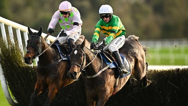 Fact To File, right, with Mark Walsh up, jumps the last on their way to finishing second, from eventual first place Gaelic Warrior, left, with Paul Townend up, during the John Durkan Memorial Punchestown Steeplechase during day two of the Punchestown Prem
