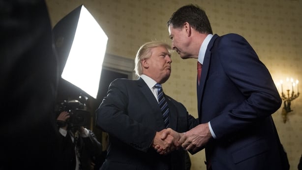 US President Donald Trump, left, shakes hands with James Comey, director of the Federal Bureau of Investigation