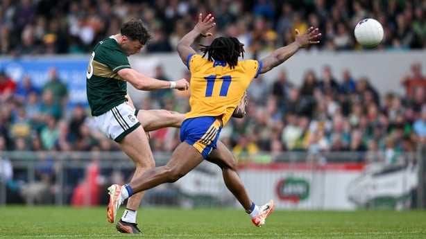 Clifford gets a shot away against Clare despite the close attention of Ikem Ugwueru 