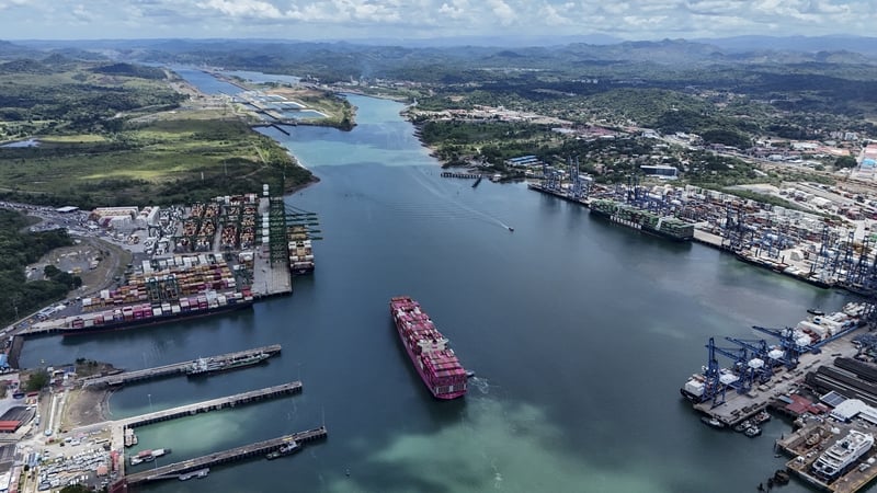 Aerial view of the One Contribution container ship sailing under the Tokio flag as it enters the Panama Canal in Panama City on April 21, 2026. According to the Panama Canal Authority, transit through the canal has increased due to the war in the Middle E