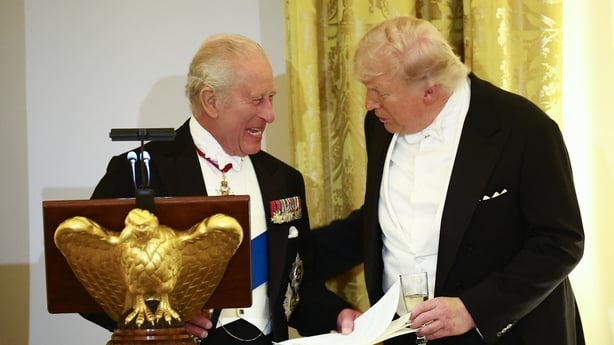 US President Donald Trump and Britain's King Charles smile as they talk during a State Dinner in the East Room of the White House