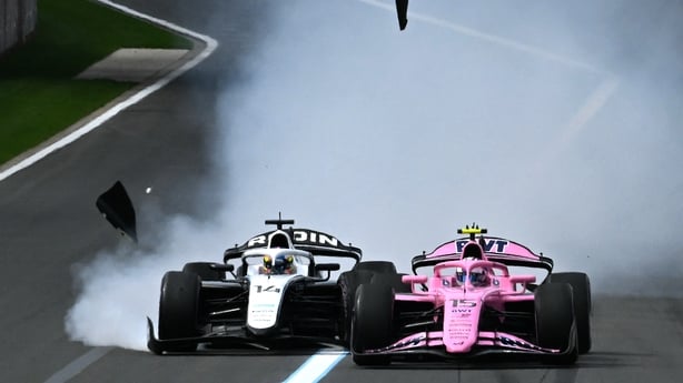 Rodin Motorsport's Norwegian driver Martinius Stenshorne (L) and his teammate, Irish driver Alexander Dunne, crash during the Australia Formula Two Feature Race at Melbourne's Albert Park Circuit on March 8, 2026, ahead of the Formula One Australian Grand Prix.