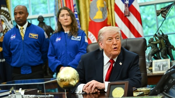 Artemis II pilot Victor Glover, from left, Artemis II mission specialist Christina Koch, and US President Donald Trump during a meeting with members of the Artemis II mission in the Oval Office of the White House in Washington, DC, US, on Wednesday, April