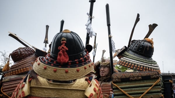 Participants dressed as a Samurai warriors look on before the start of the second day of the two-day Hinode Sai, or Sunrise festival