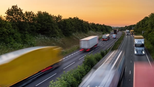 heavy traffic moving at speed on motorway