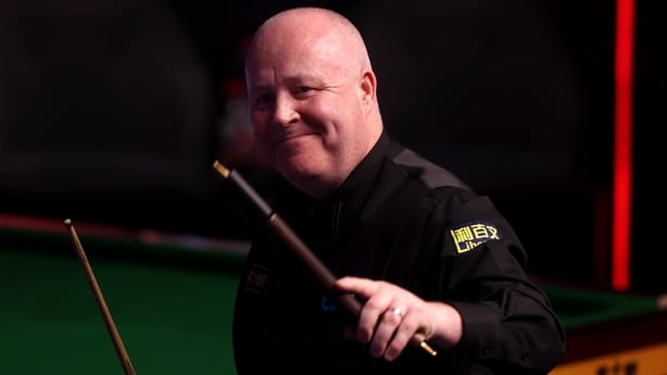 John Higgins of Scotland celebrates victory following the quarter final match against Neil Robertson of Australia on day twelve of the Halo World Snooker Championship at The Crucible Theatre on April 29, 2026 in Sheffield, England. 