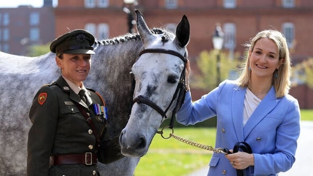 Lt. Col Sharon Crean and Minister for Defence Helen McEntee stand with pony 'Templeshambo' at army equitation school
