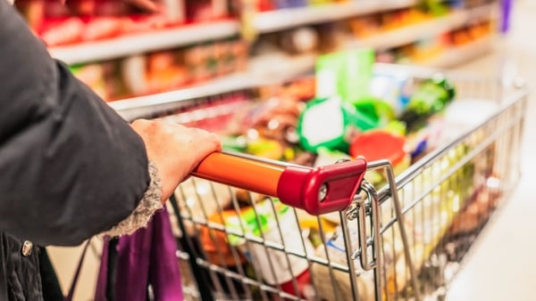 Close up of a woman's hand on a supermarket trolley