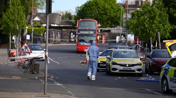 A forensics officer at a scene in Golders Green in London after a stabbing attack