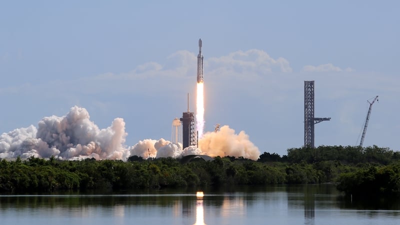 A SpaceX Falcon Heavy rocket launches from Kennedy Space Center's Launch Pad 39-A