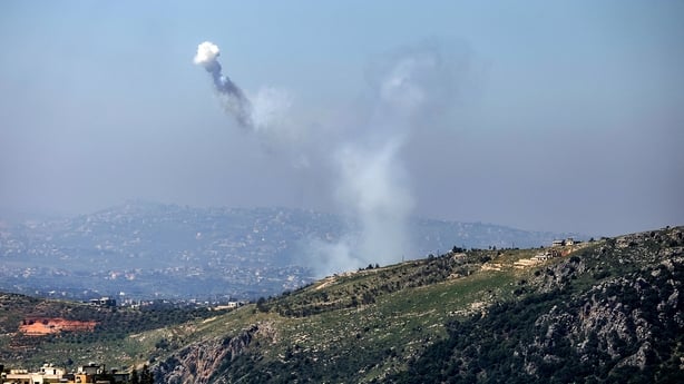 A photograph taken from the southern Lebanese area of Marjeyoun shows the smoke traces of Israeli shelling as it targets the village of Yohmor 